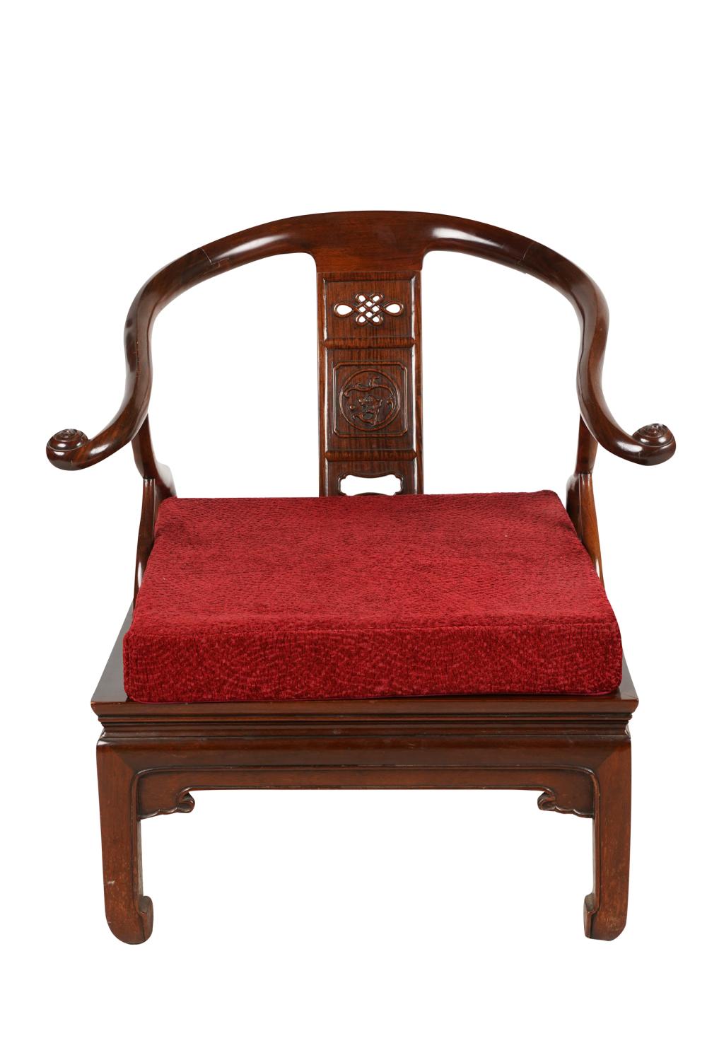 Appraisal: CHINESE CARVED HARDWOOD HORSESHOE ARMCHAIRwith pierced slightly curved splat together