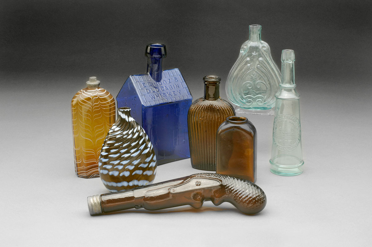 Appraisal: GROUP OF FREE-BLOWN BLOWN-MOLDED AND PRESSED GLASS BOTTLES Comprising a