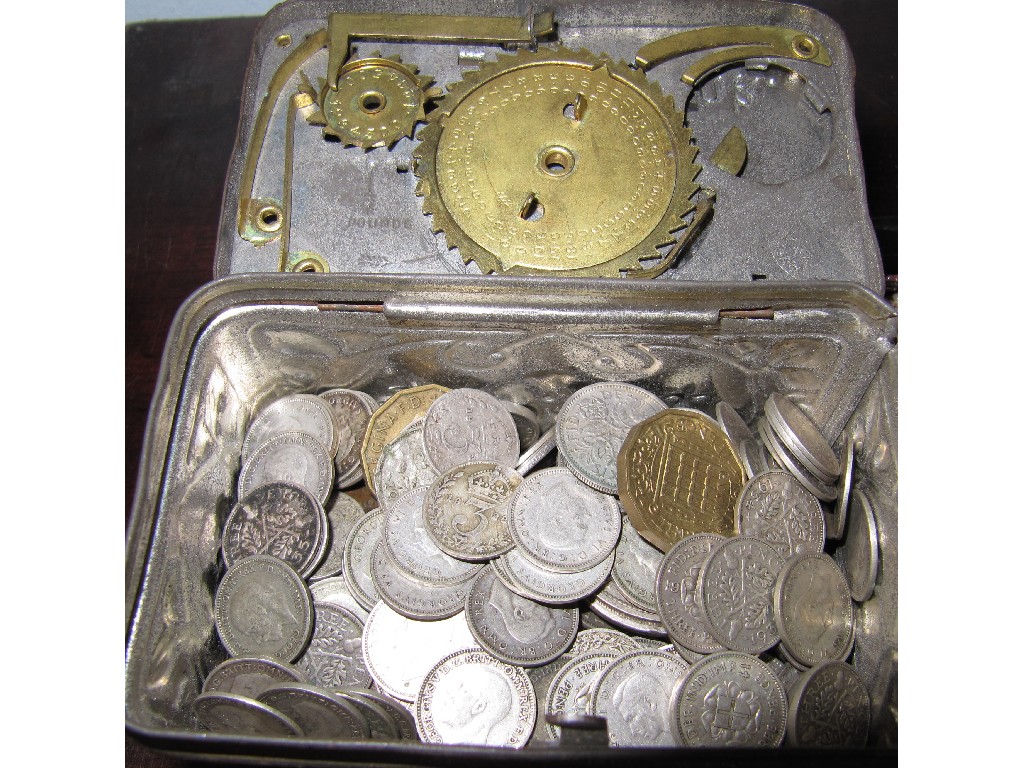 Appraisal: Tin bank with a quantity of assorted coins