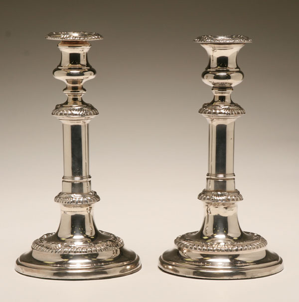 Appraisal: Pair Old Sheffield silverplate candlesticks Columnar stems and Rococo style