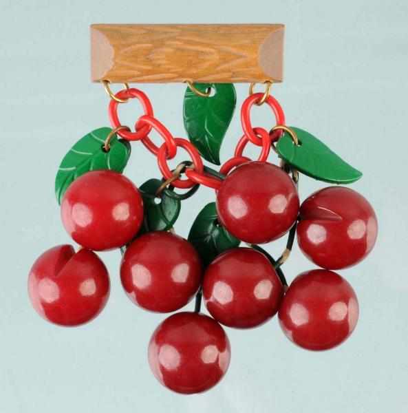 Appraisal: Vintage Bakelite Carved Bing Cherry Brooch Description Wooden bar and