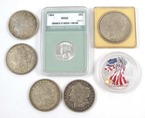 Appraisal: SEVEN U S SILVER COINS The lot includes five Morgan