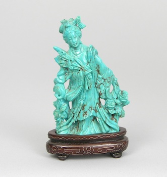 Appraisal: A Carved Turquoise Figure of a Maiden with a Sword