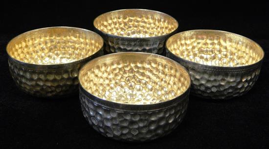 Appraisal: Four Continental silver hand-washing bowls with gilt-washed interiors hammered exteriors