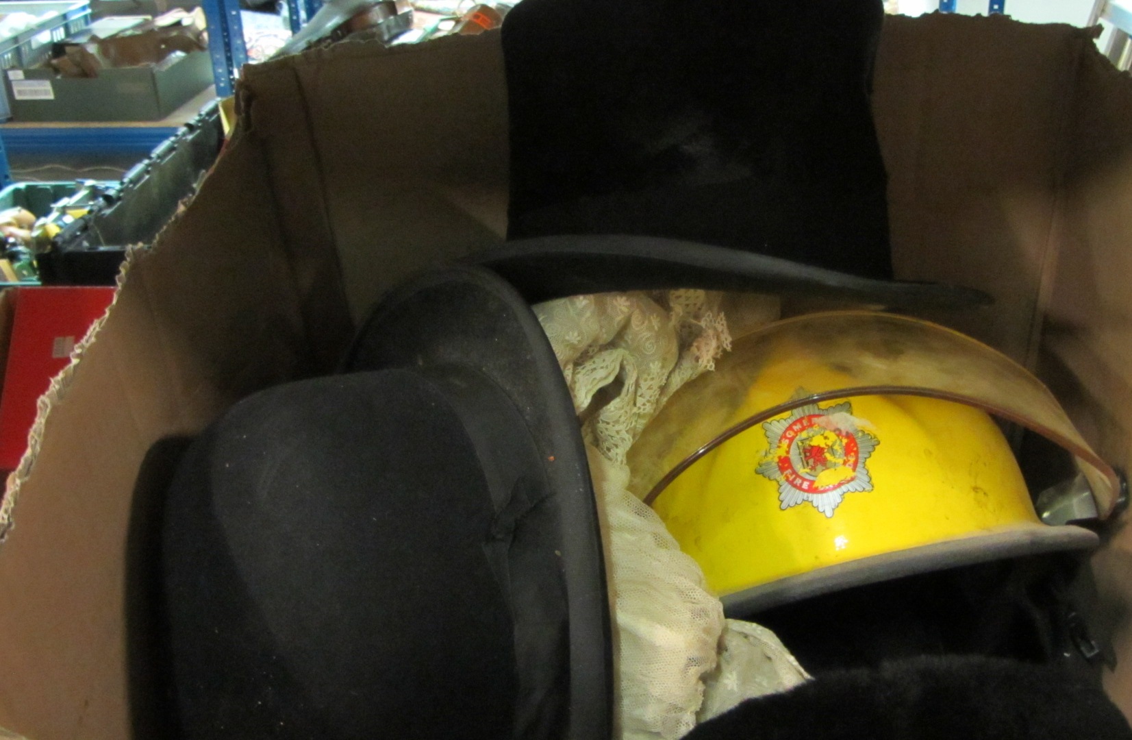 Appraisal: Clothing two th century fireman's helmets one Russian hat one