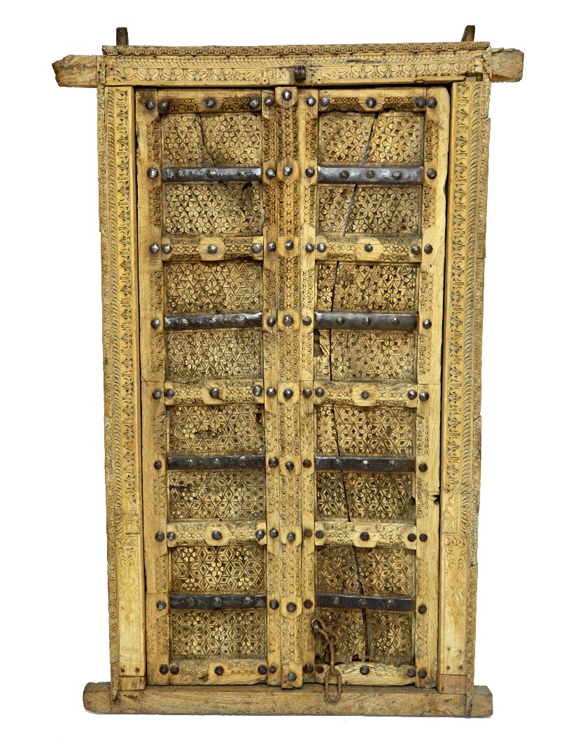 Appraisal: A th century Indian profusely carved metal bound double door