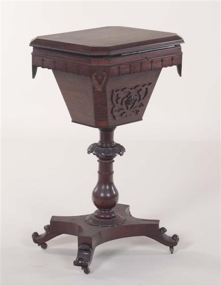 Appraisal: A Victorian rosewood work table the chamfered lid with canted