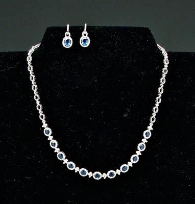 Appraisal: Sapphire and diamond necklace oval faceted intense medium to dark