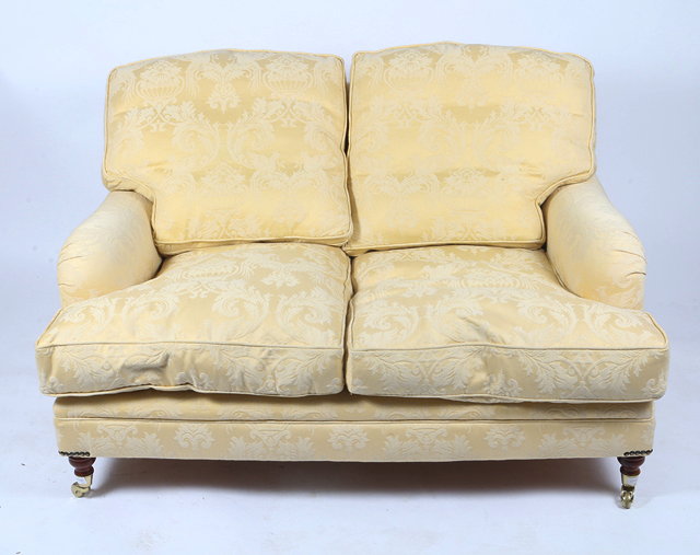 Appraisal: A HOWARD STYLE YELLOW AND ACANTHUS LEAF DECORATED TWO SEATER