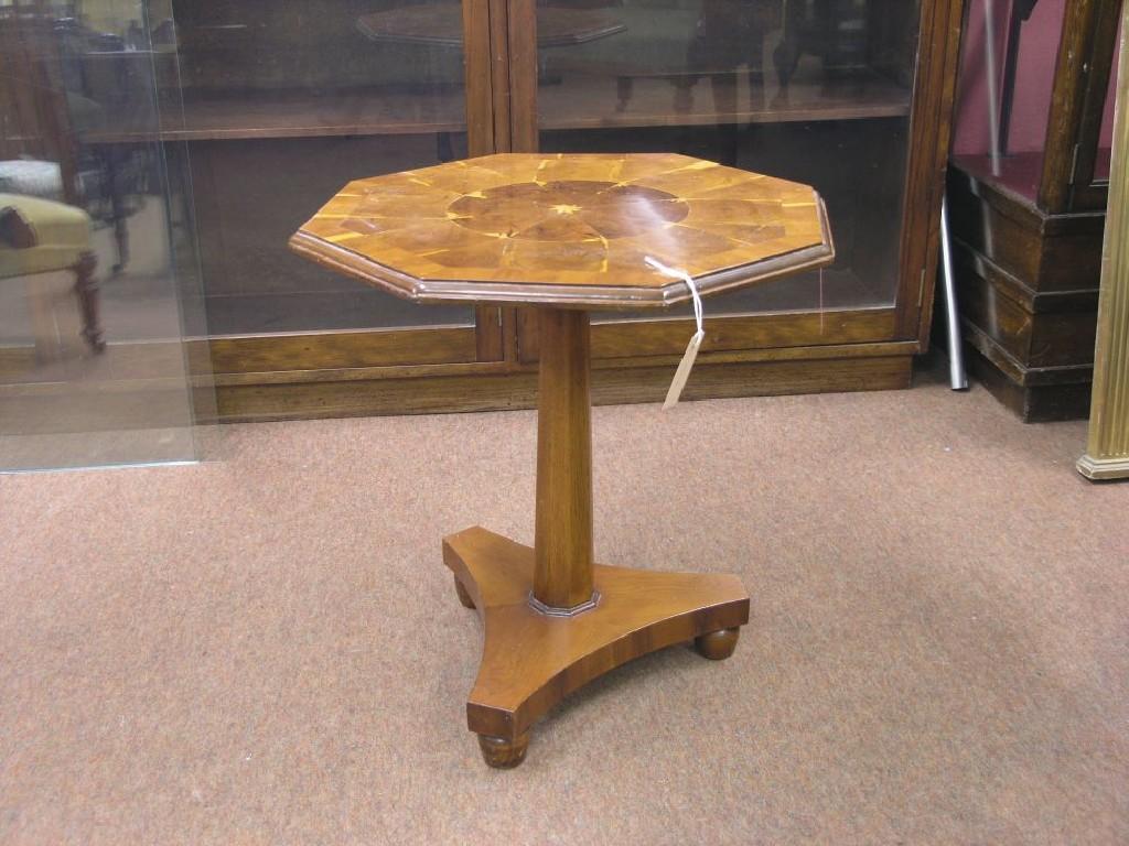 Appraisal: A yew wood wine table octagonal cross-banded top veneered in