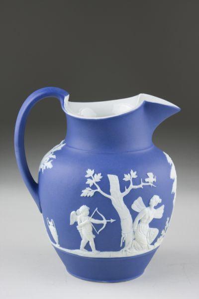 Appraisal: Wedgwood Blue Jasperware Pitcher th c ovoid with painted beak