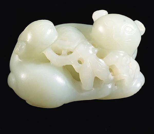 Appraisal: A white jade toggle of two cats th Century The