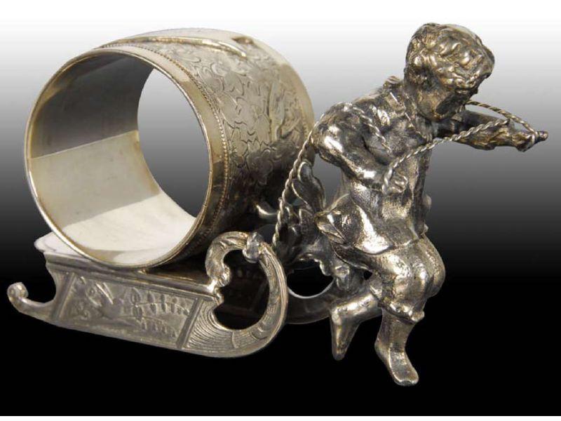 Appraisal: Boy On Sled Figural Napkin Ring Description Marked Wilcox Silver