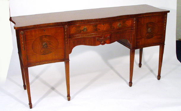 Appraisal: Reproduction line inlaid mahogany serpentine fronted sideboard with urn and