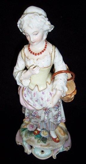 Appraisal: A th Century Meissen figure of a woman carrying a