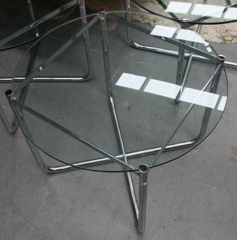 Appraisal: A glass and chrome circular side table cm diameter cm