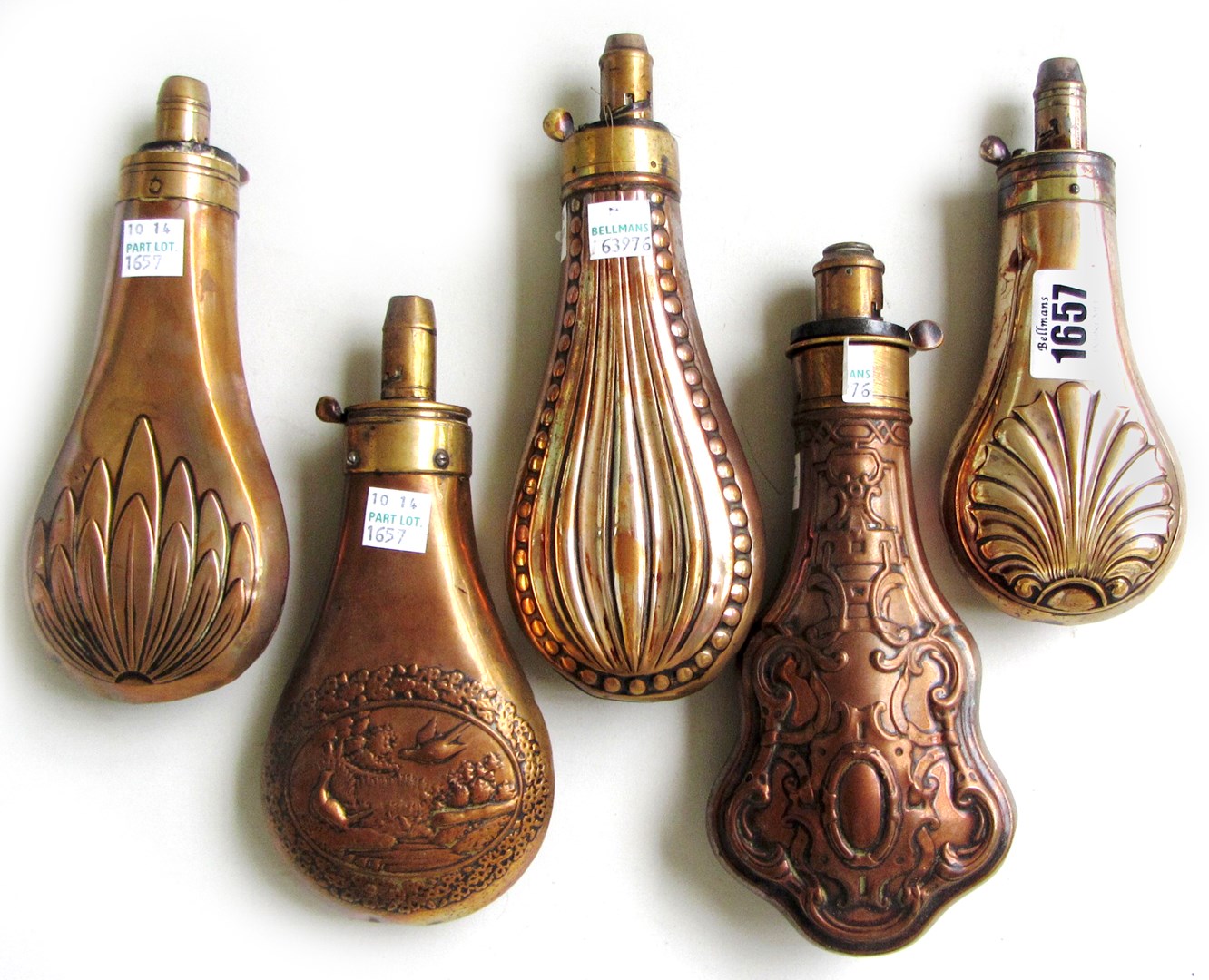 Appraisal: Five copper and brass mounted shot flasks th century the