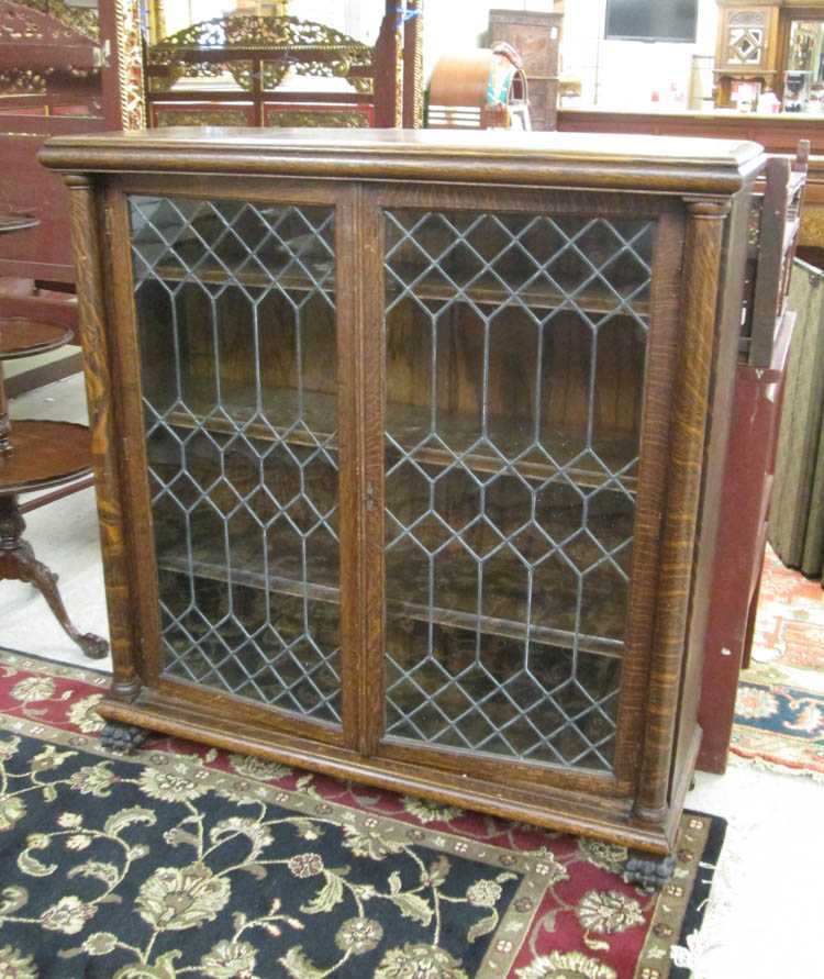 Appraisal: AN OAK AND LEADED GLASS CABINET BOOKCASE American late th