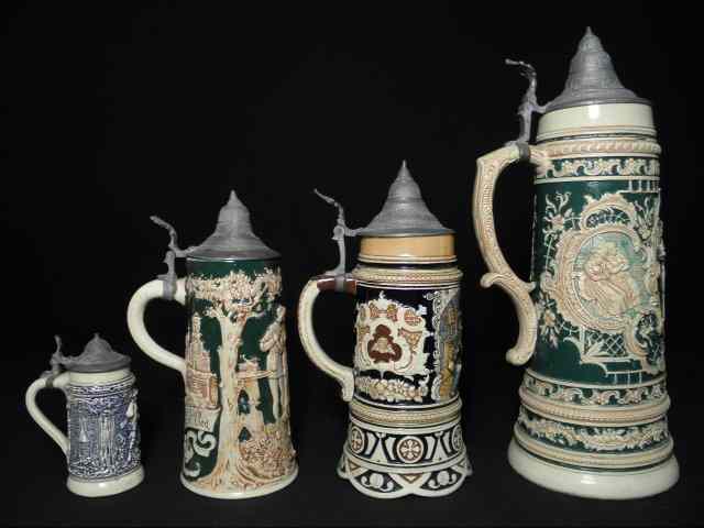 Appraisal: Lot of four German porcelain beer steins Painted porcelain with