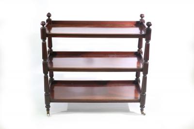 Appraisal: A Victorian mahogany three-tier buffet with gadrooned finials to the