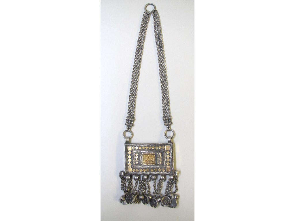 Appraisal: A Persian white metal and gilt applied purse suspended with