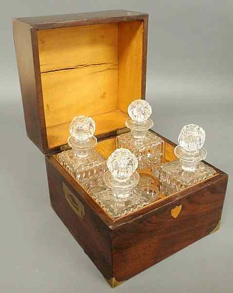 Appraisal: Georgian four-bottle decanter set with a brass inlaid mahogany case