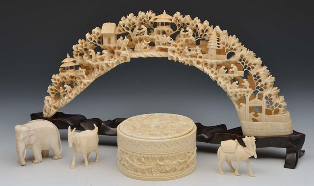 Appraisal: A CHINESE CANTON IVORY CYLINDRICAL BOX carved dragons and clouds