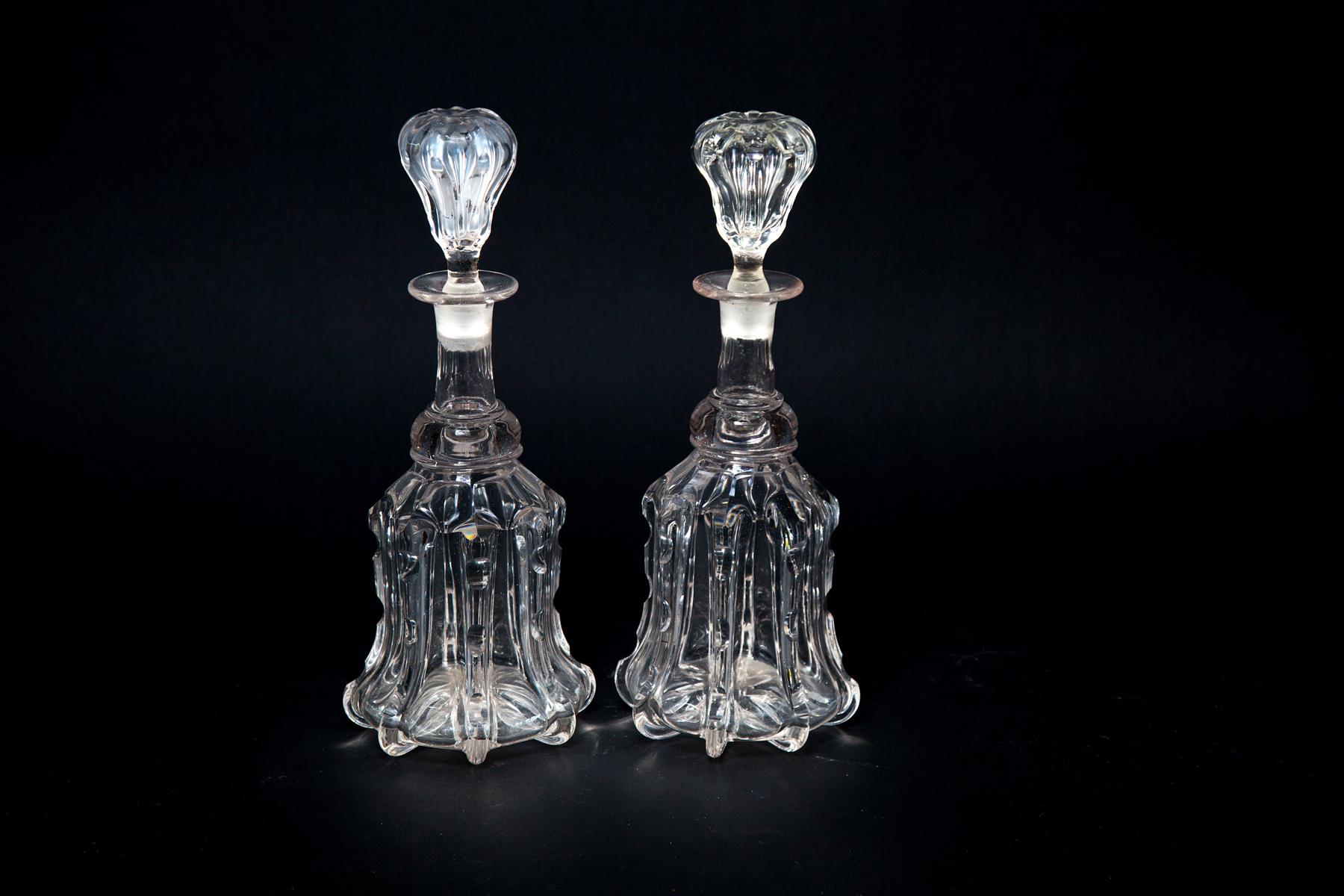 Appraisal: PAIR OF PITTSBURGH PILLAR BLOWN NOTCHED RIBBED DECANTERS American mid