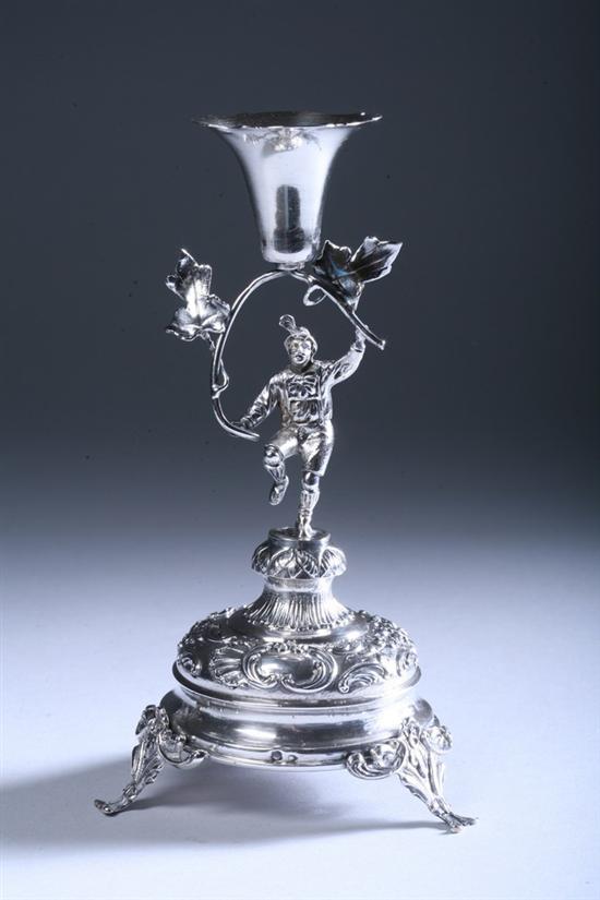 Appraisal: WHIMSICAL CONTINENTAL SILVER FIGURAL CANDLESTICK early th century Circular foot