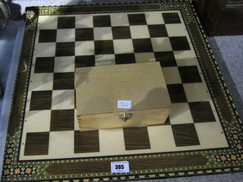 Appraisal: Chessboard with chessmen