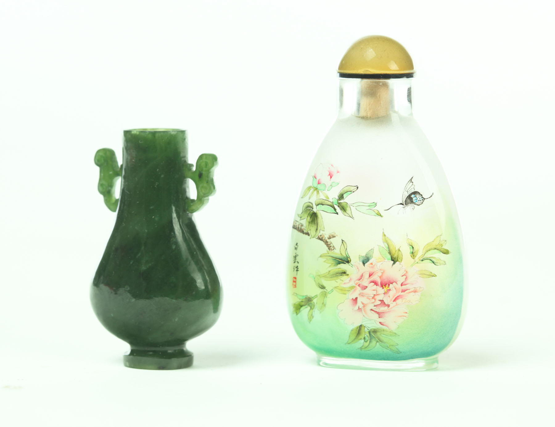 Appraisal: TWO SNUFF BOTTLES China late th century Spinach green jade