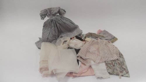 Appraisal: A quantity of dolls' dresses hats and offcut material