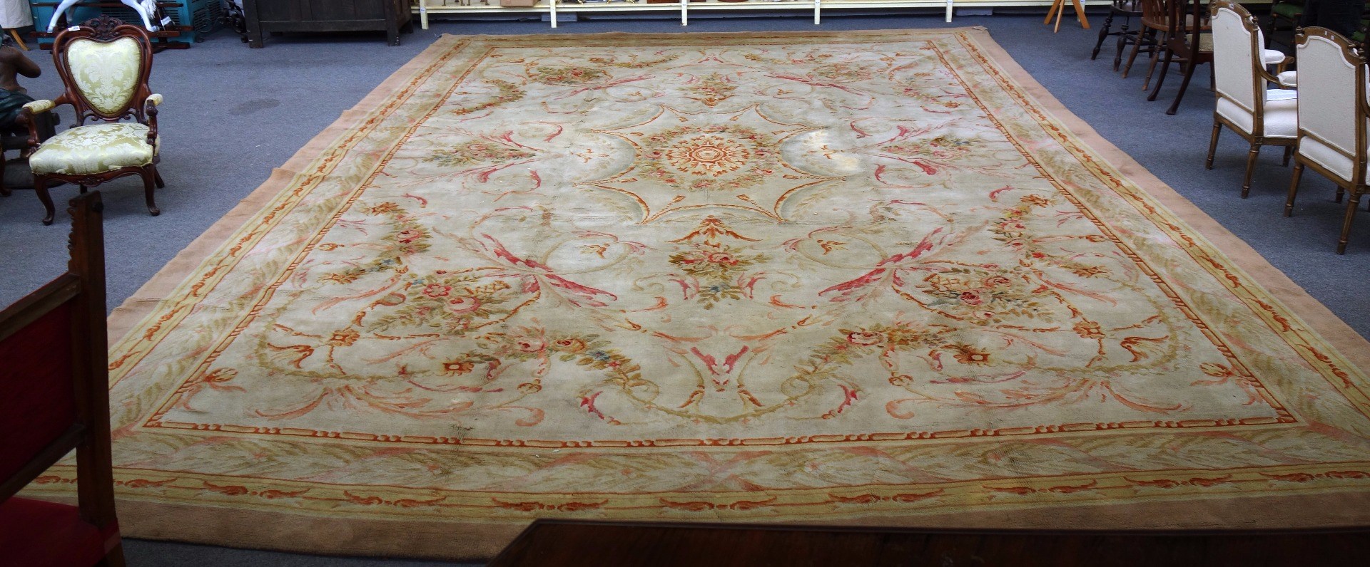 Appraisal: A Savonnerie carpet the ivory field with a star medallion