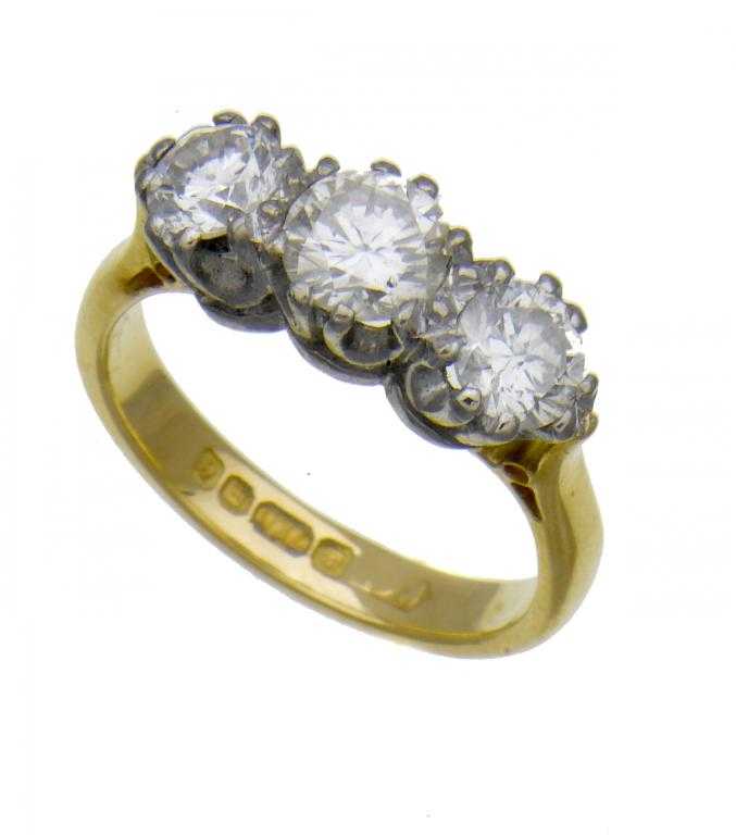 Appraisal: A DIAMOND THREE-STONE RING ct gold hoop London