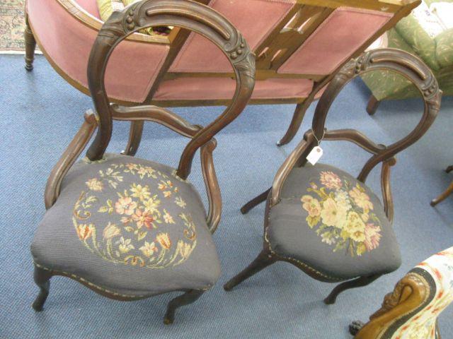 Appraisal: Pair of Victorian Side Chairs mahogany carved balloon back needlepoint