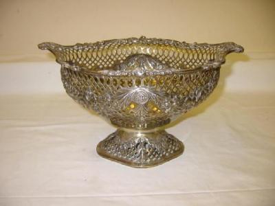 Appraisal: AN EDWARDIAN FRUIT BASKET of shaped oval form with flower