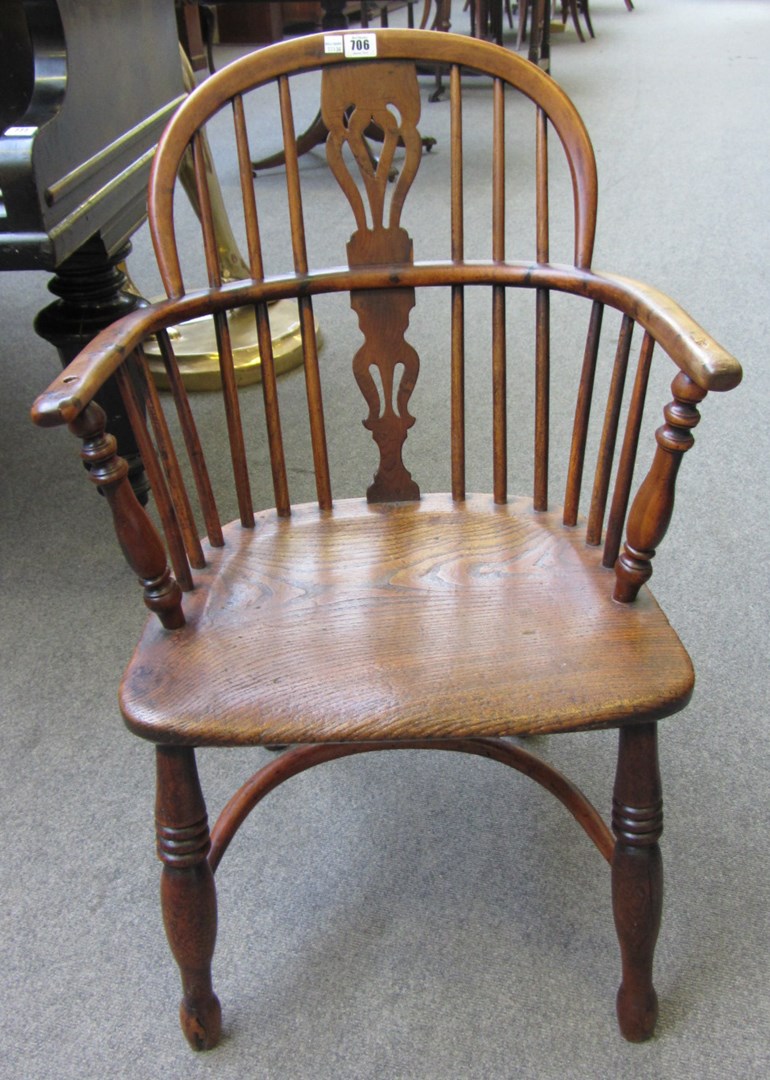 Appraisal: A George III yew and elm bow back Windsor chair