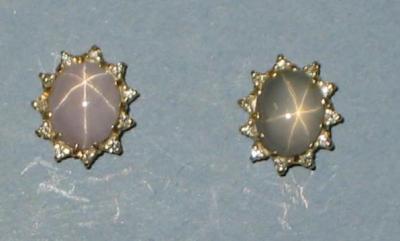 Appraisal: A PAIR OF STAR SAPPHIRE AND DIAMOND CLUSTER STUD EARRINGS