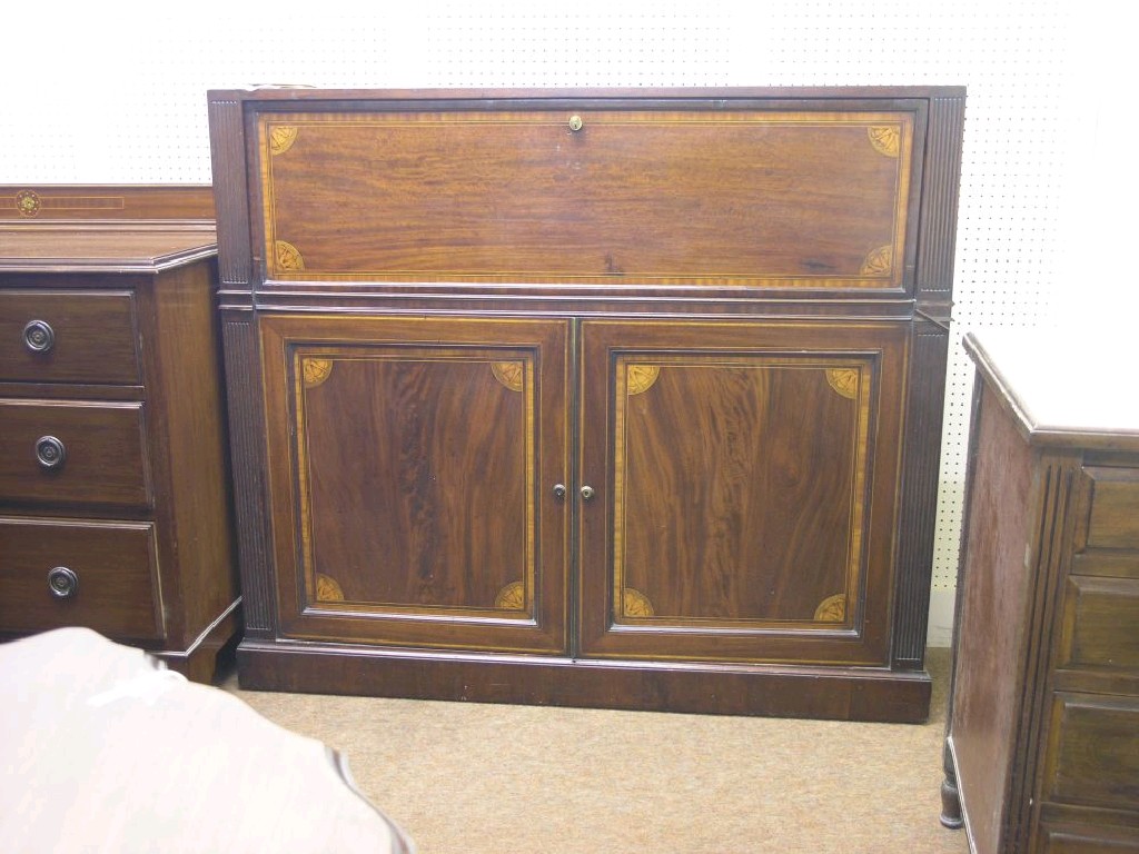 Appraisal: An inlaid mahogany secretaire fall-front enclosing fittings above a pair