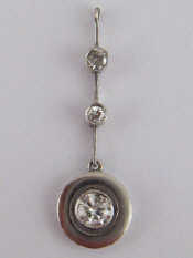 Appraisal: A French hallmarked platinum and diamond drop pendant the principal