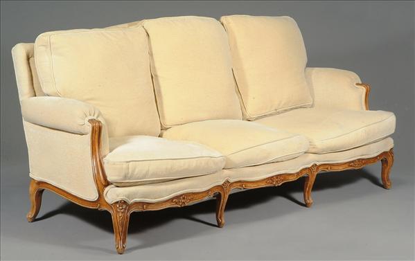 Appraisal: A beech framed and upholstered sofa in Louis XV style