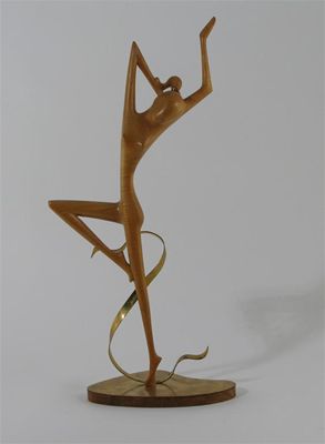 Appraisal: A Hagenauer wood and brass model of a woman dancing