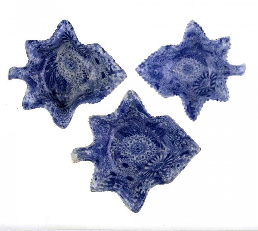 Appraisal: THREE BLUE PRINTED EARTHENWARE FLOWERS AND LEAVES PATTERN PICKLE DISHES