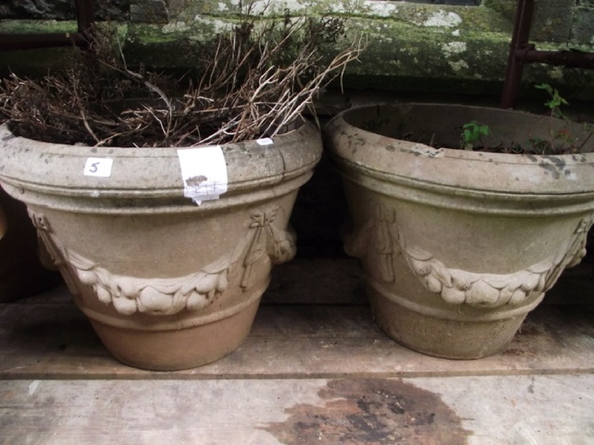 Appraisal: A pair of buff coloured cast composition stone garden planters