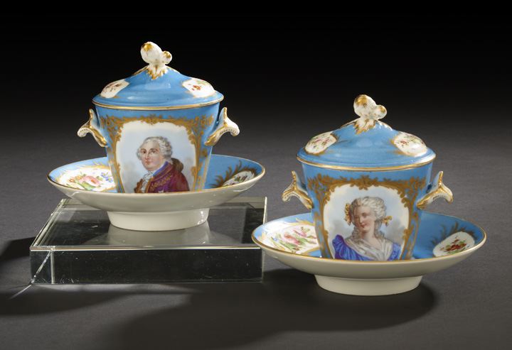 Appraisal: Pair of Paris Bleu-du-Ciel-Ground Porcelain Covered Two-Handled Trembleuses and Underplates