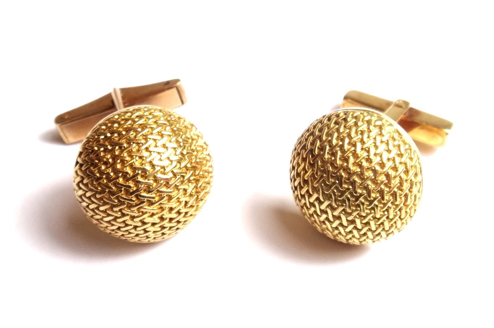 Appraisal: A pair of gold cufflinks each with a hemispherical front