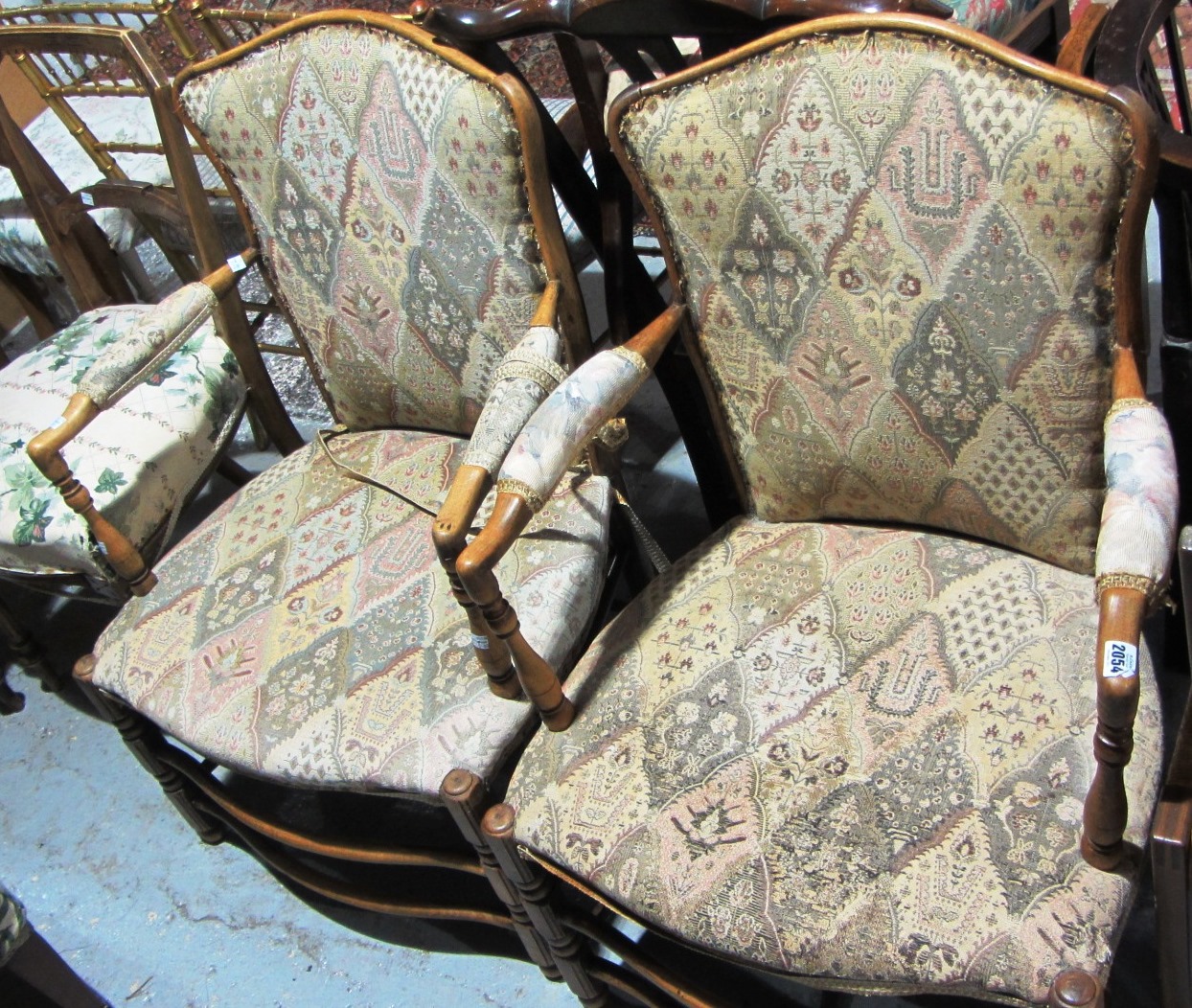 Appraisal: A pair of late th century ladder back upholstered fauteuils