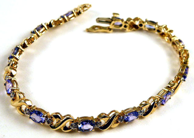 Appraisal: TANZANITE AND DIAMOND BRACELET k yellow gold set with twelve