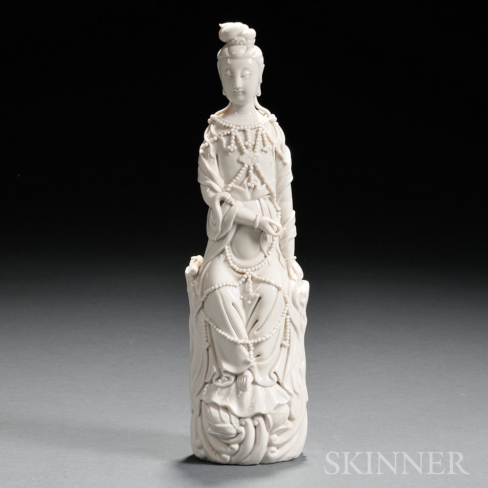 Appraisal: Blanc-de-chine Figure of Guanyin China seated on a rock with