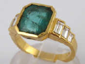 Appraisal: A yellow metal tests carat gold emerald and diamond ring